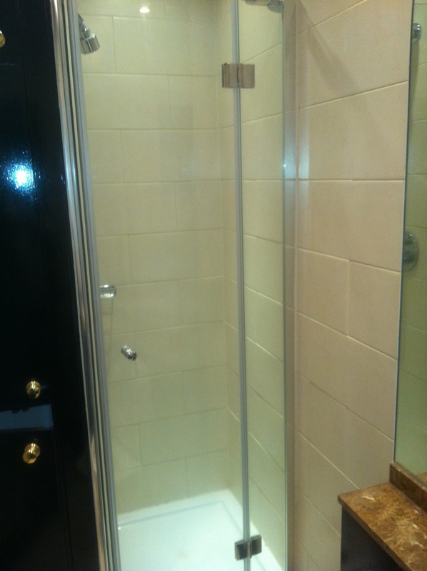 Frameless glass shower enclosure with chrome fittings in Newbury