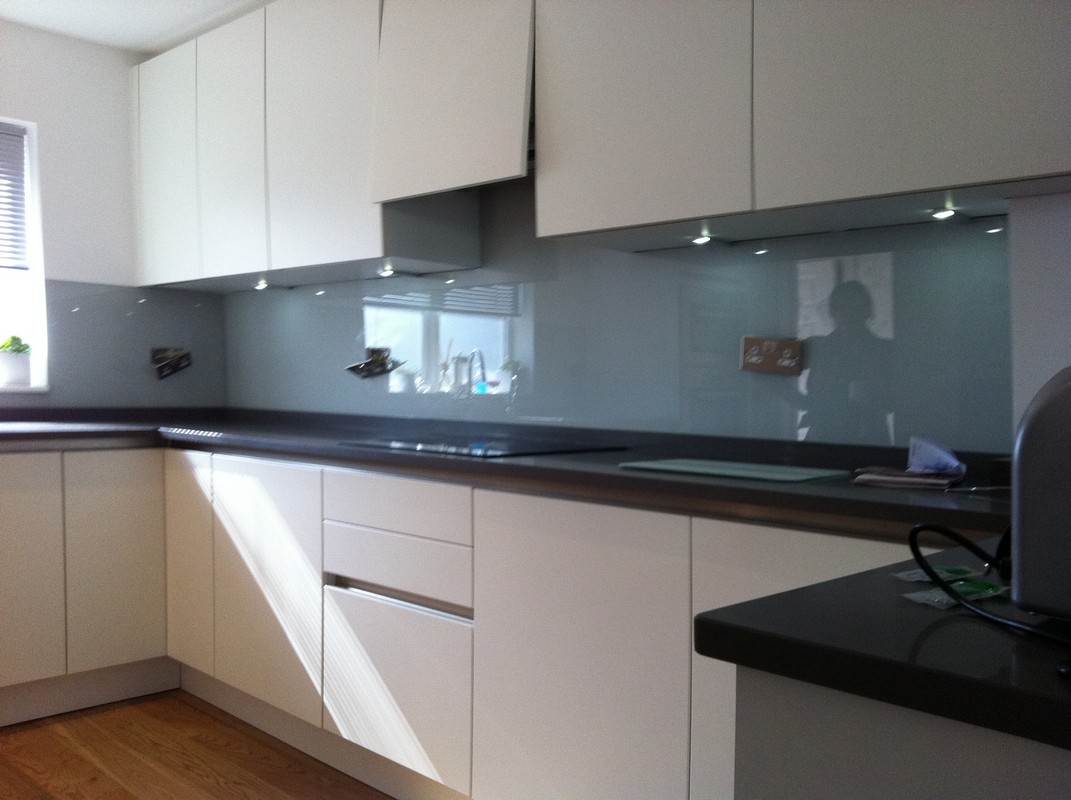 Grey glass kitchen splashback with LED lighting in Newbury