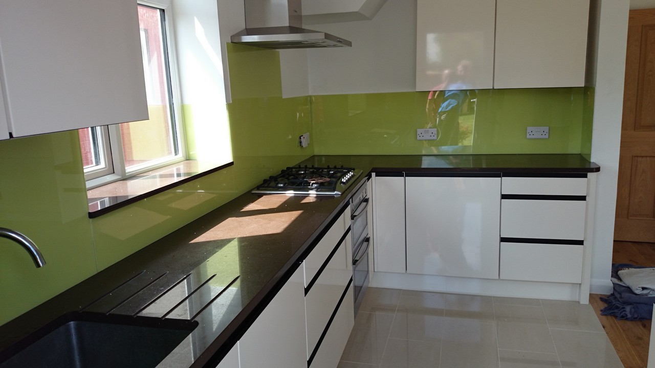 Lime green glass kitchen splashback installed by Newbury glaziers