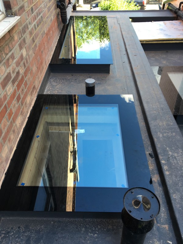Multiple flat roof skylights on extension in Newbury