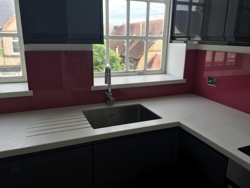 Deep plum coloured glass splashback in modern Newbury kitchen